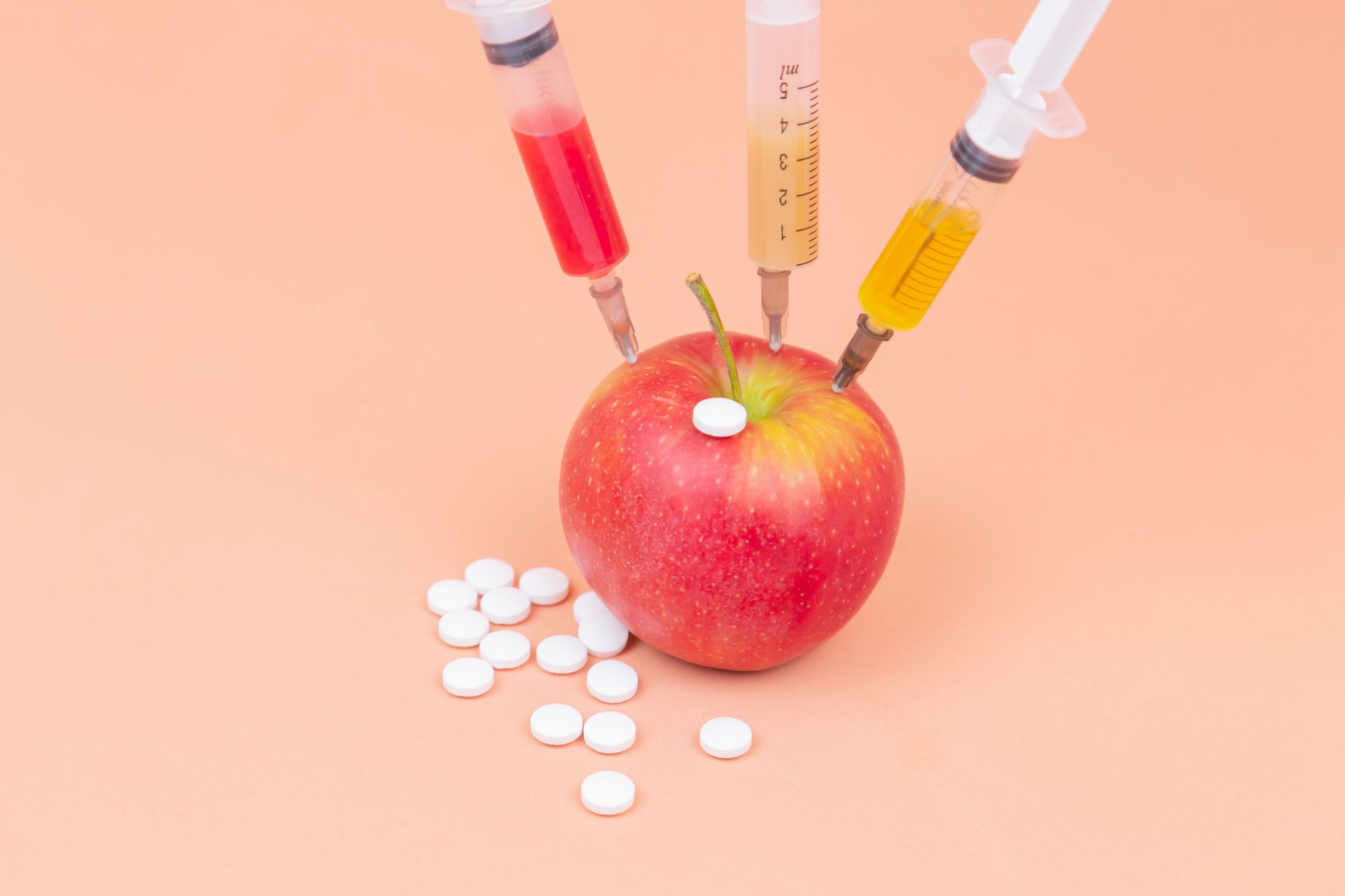 injecting medicines in an apple
